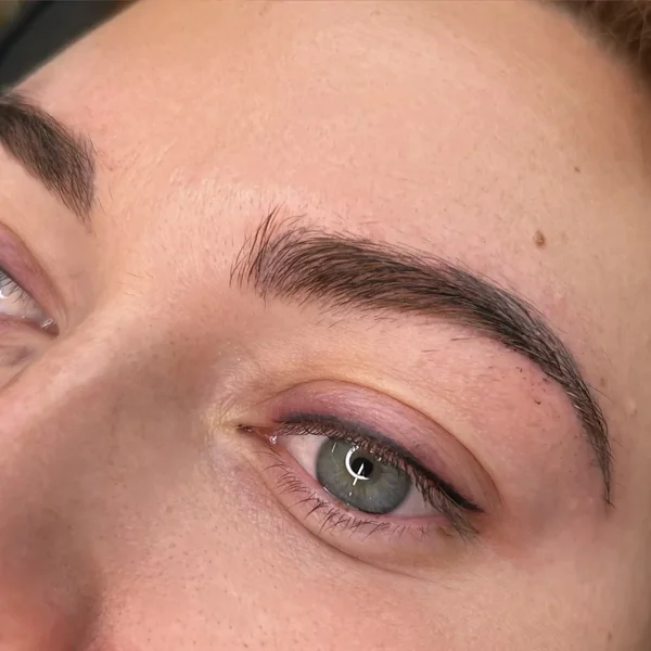 Mature lash line before eyeliner enhancement — sparse natural lashes